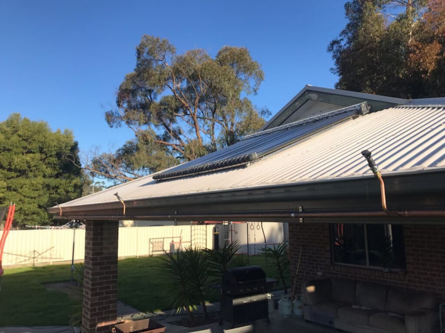 Sprinkler pipework running along a roof ridge and eave