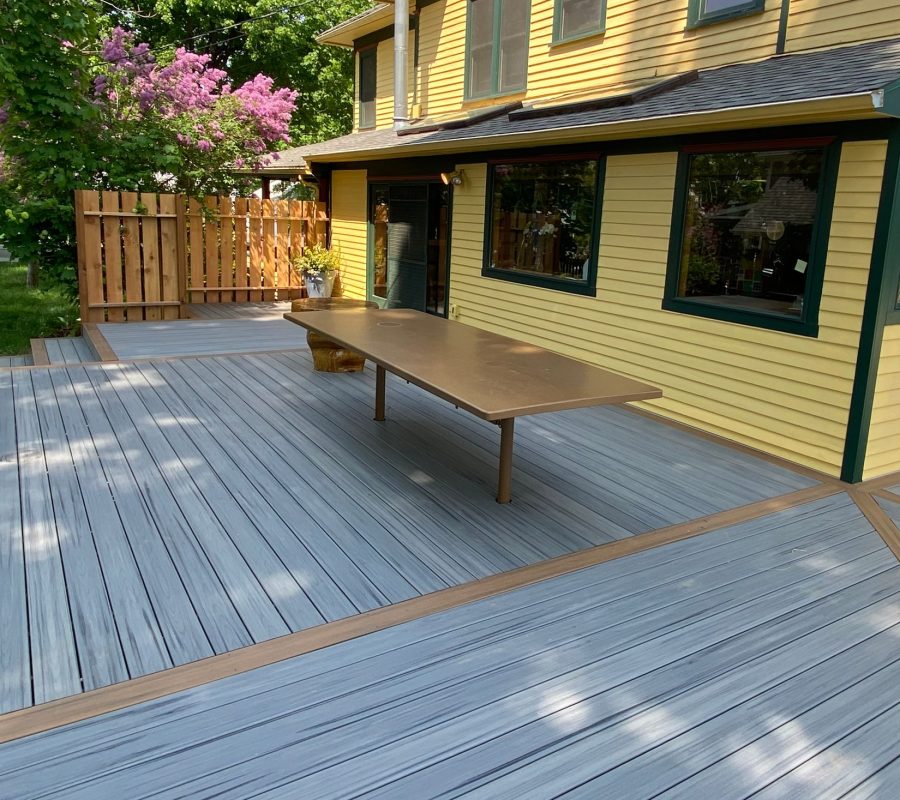 Completed wraparound composite deck on a restored home